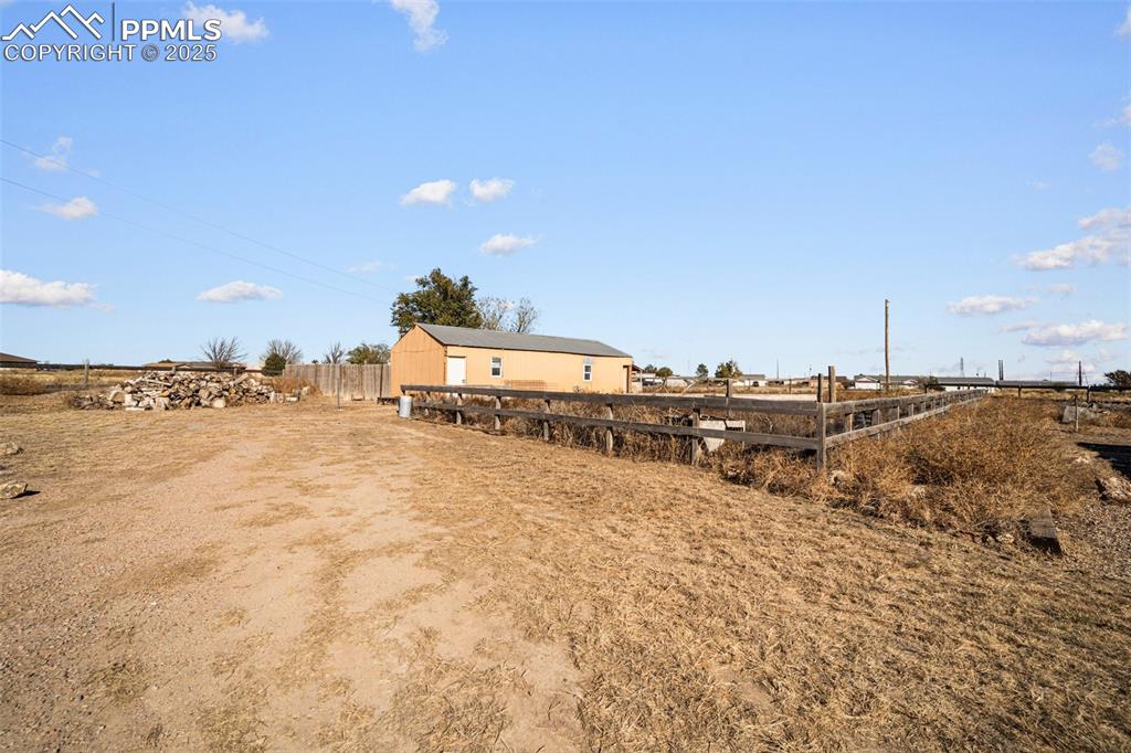 Image 12 of 12: Rear view of house featuring a view of countryside