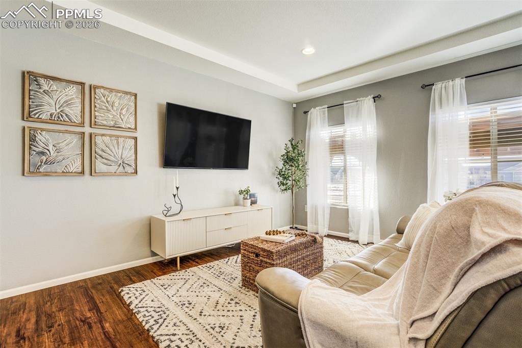 Image 5 of 43: Trace ceilings, beautiful flooring, and recessed lighting on the main level
