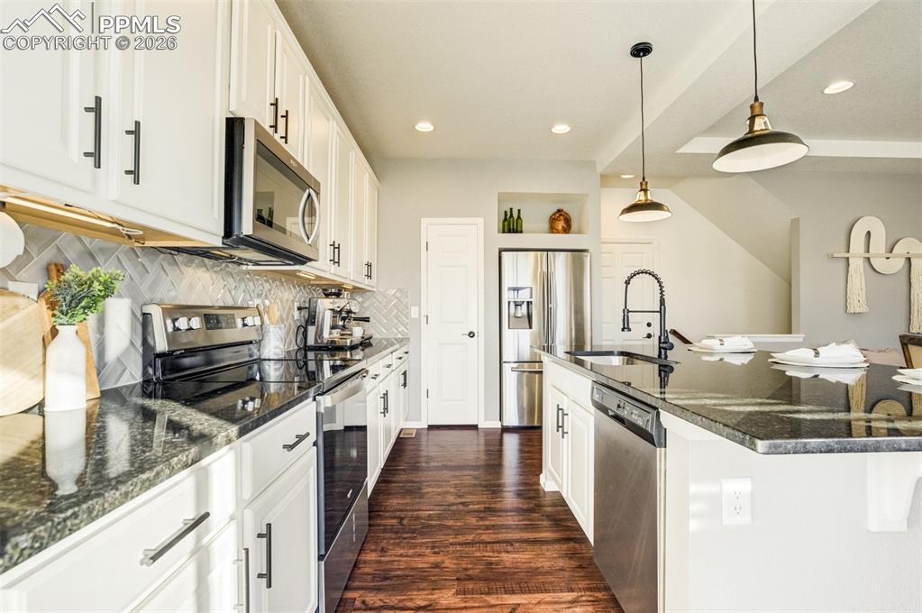 Image 8 of 43: Clean white cabinets with stone counters. Timeless yet modern. 