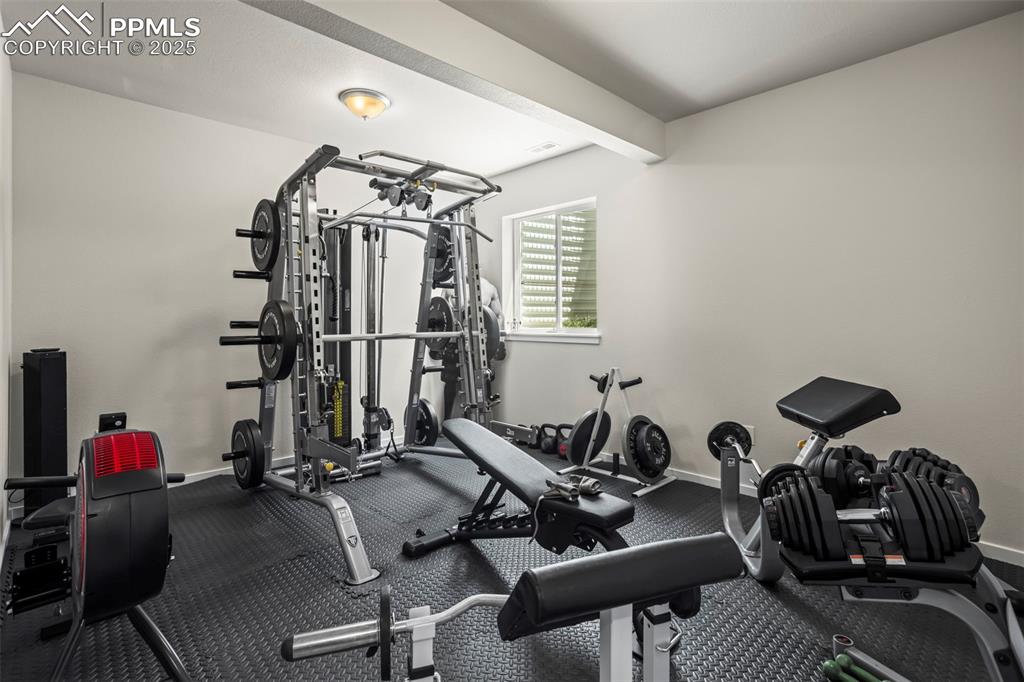 Image 24 of 26: Bedroom used as gym space