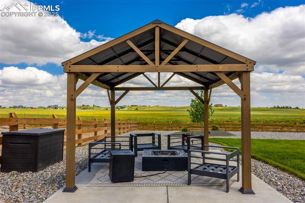 Image 6 of 26: Covered concrete space in Back yard