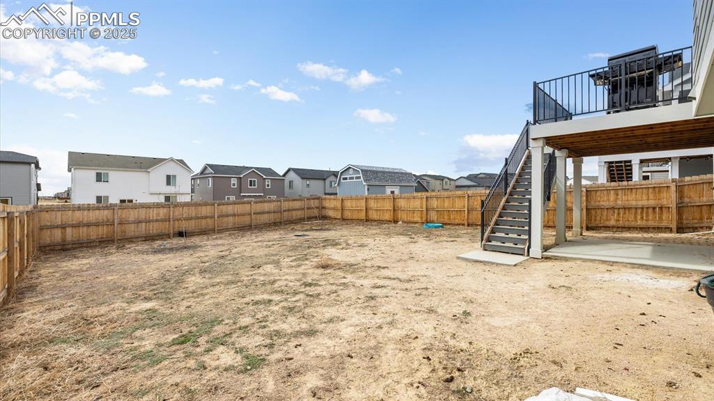 Image 44 of 46: Fenced level yard for your kids and animals to play.