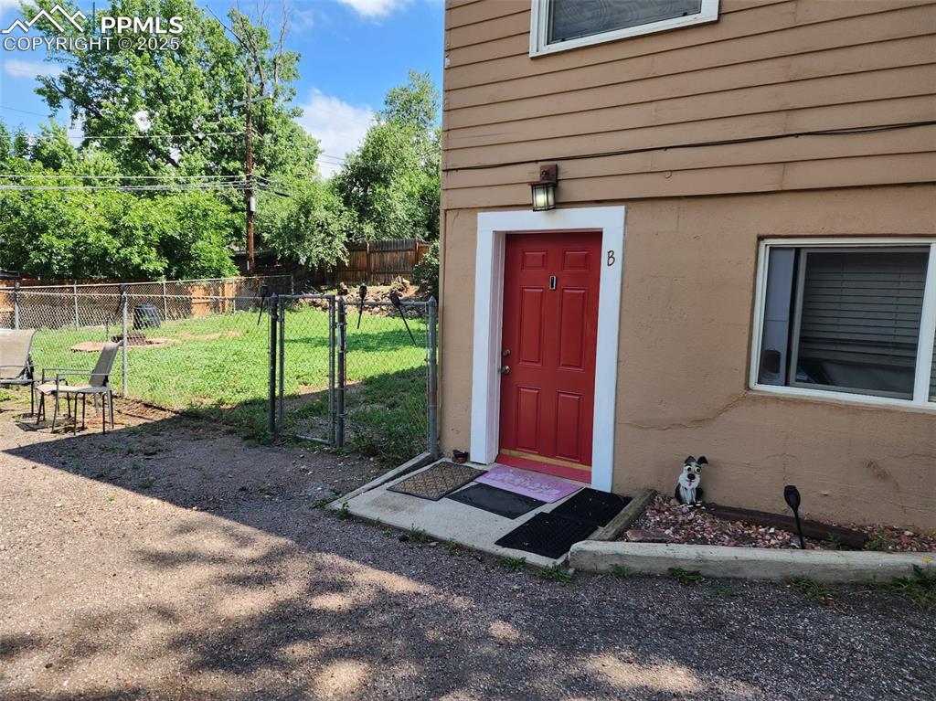 Image 4 of 24: Driveway, off street parking and entrance to Unit B 