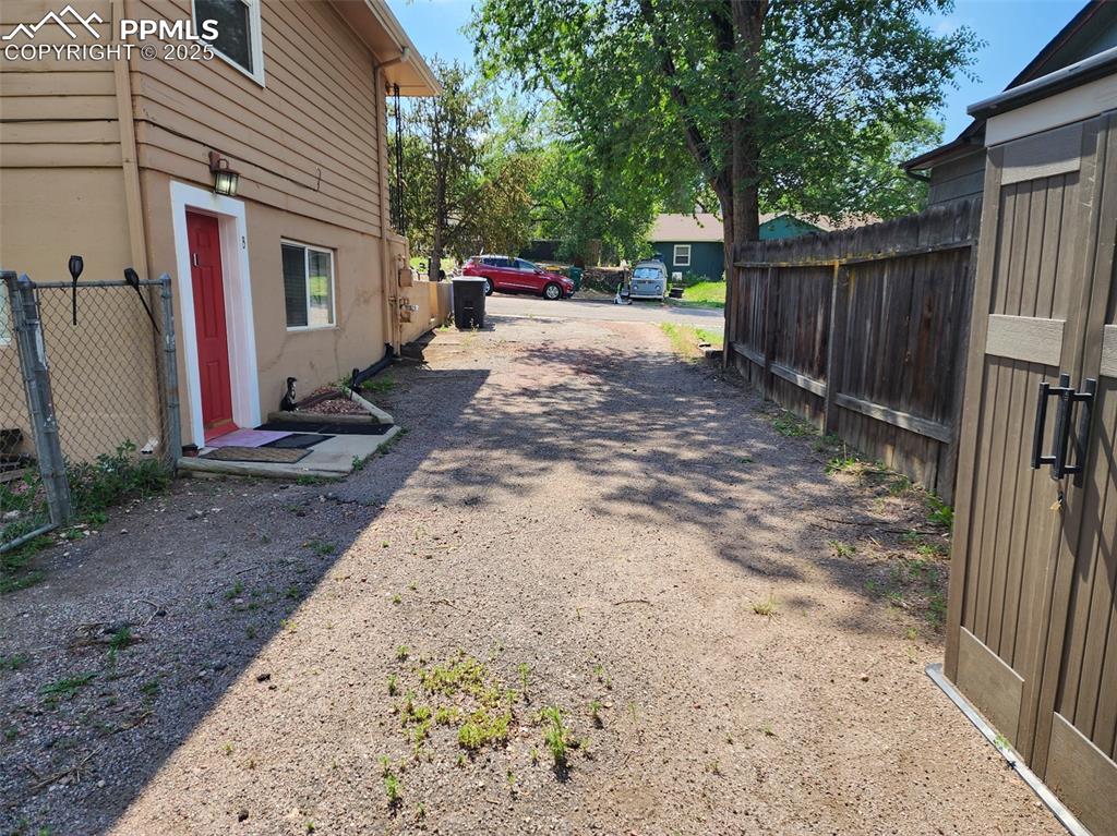 Image 7 of 24: Huge fenced back yard with deck 