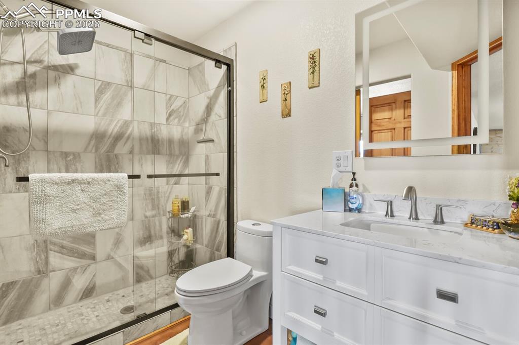Image 24 of 41: Bathroom with Double vanity, a Spa shower
