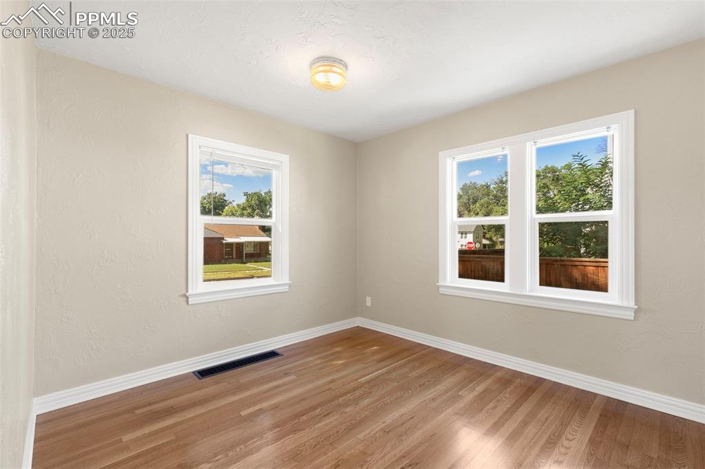 Image 18 of 48: One of two main level bedrooms