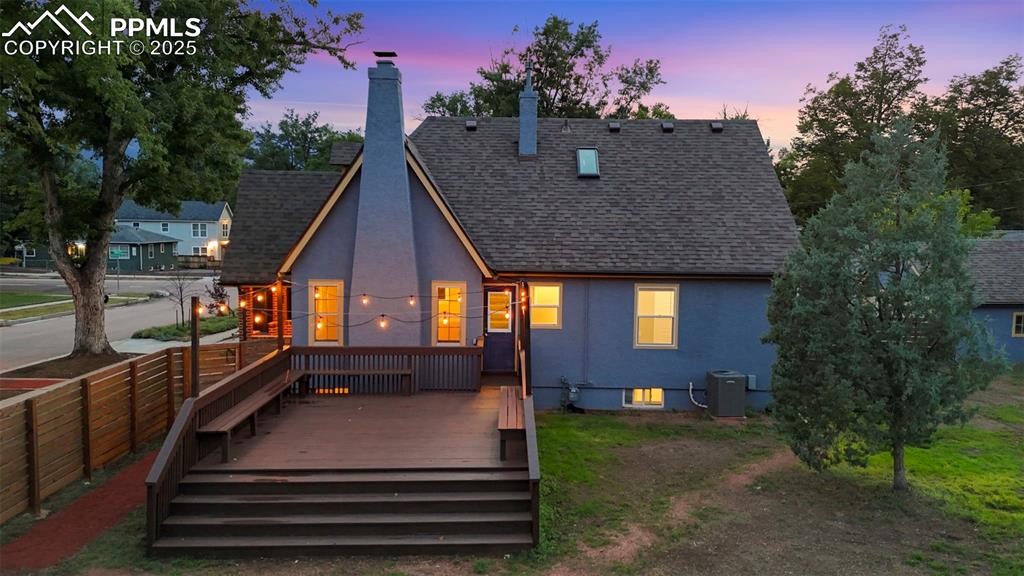 Image 43 of 48: Expansive and freshly painted rear deck