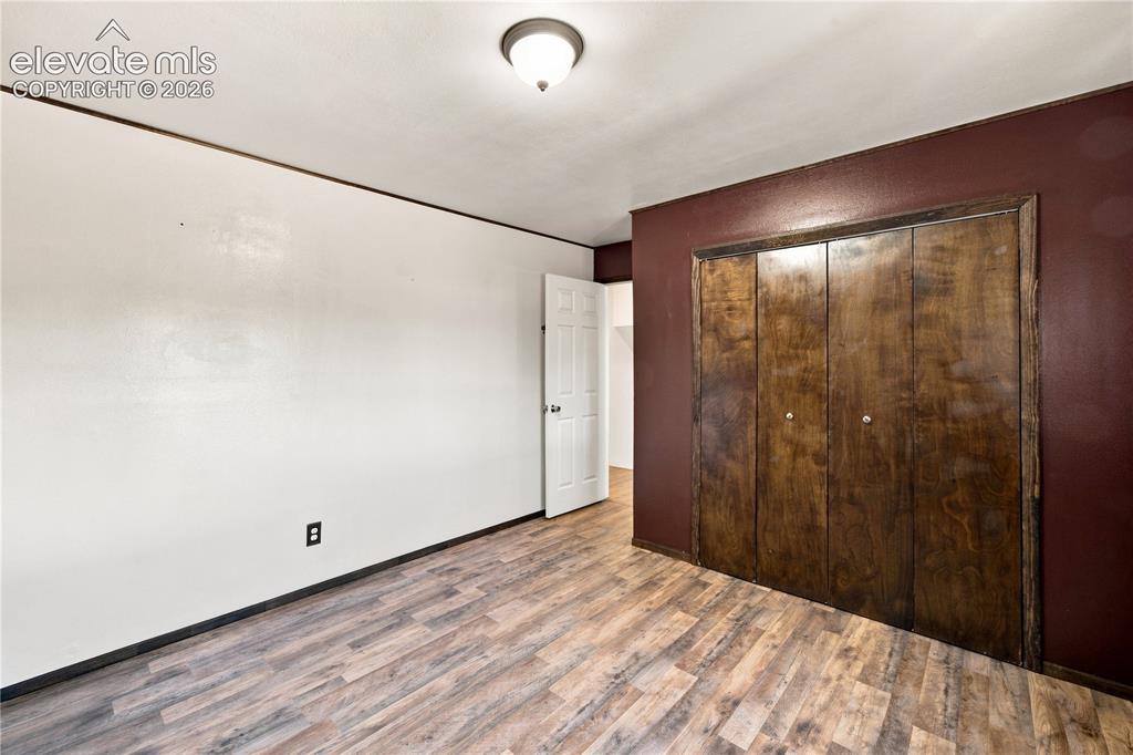 Image 16 of 39: Wood-finish flooring throughout