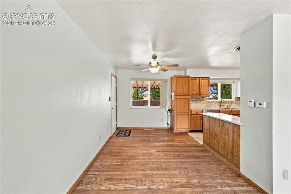 Image 6 of 39: Hardwood flooring extends throughout