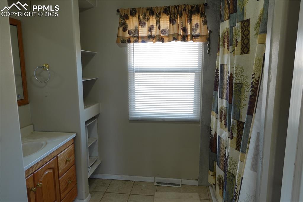 Image 10 of 26: Main level bathroom