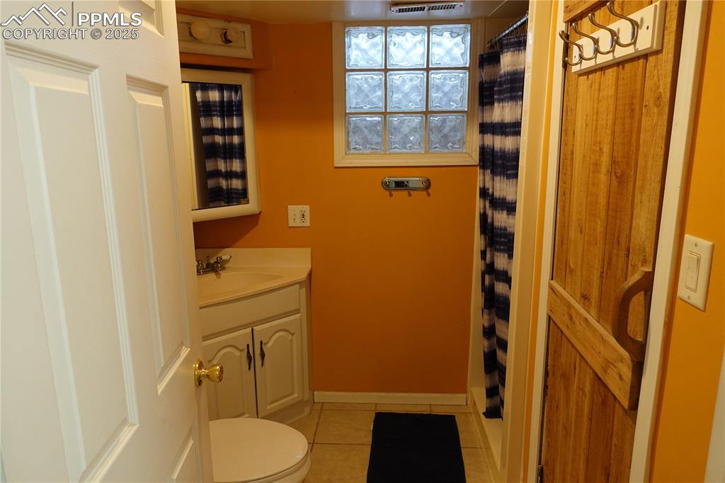 Image 14 of 26: basement bathroom with sauna