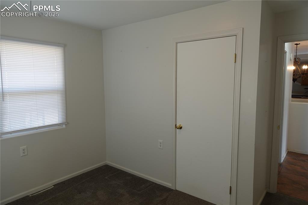 Image 9 of 26: Second bedroom on main level