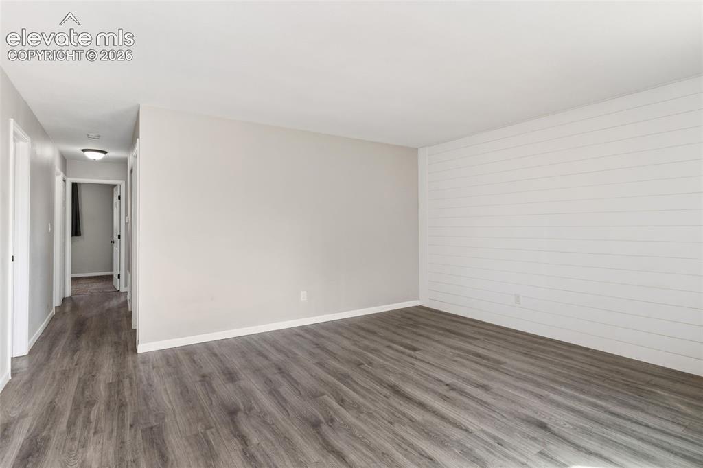 Image 3 of 22: Living Room with shiplap wall