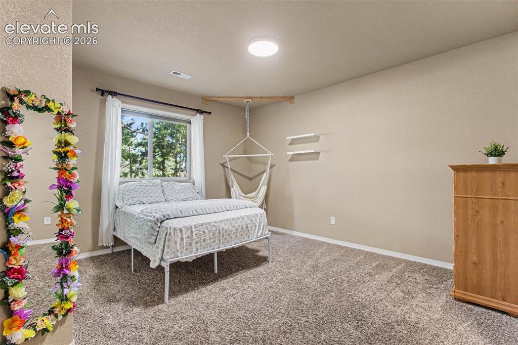 Image 31 of 47: Basement Bedroom