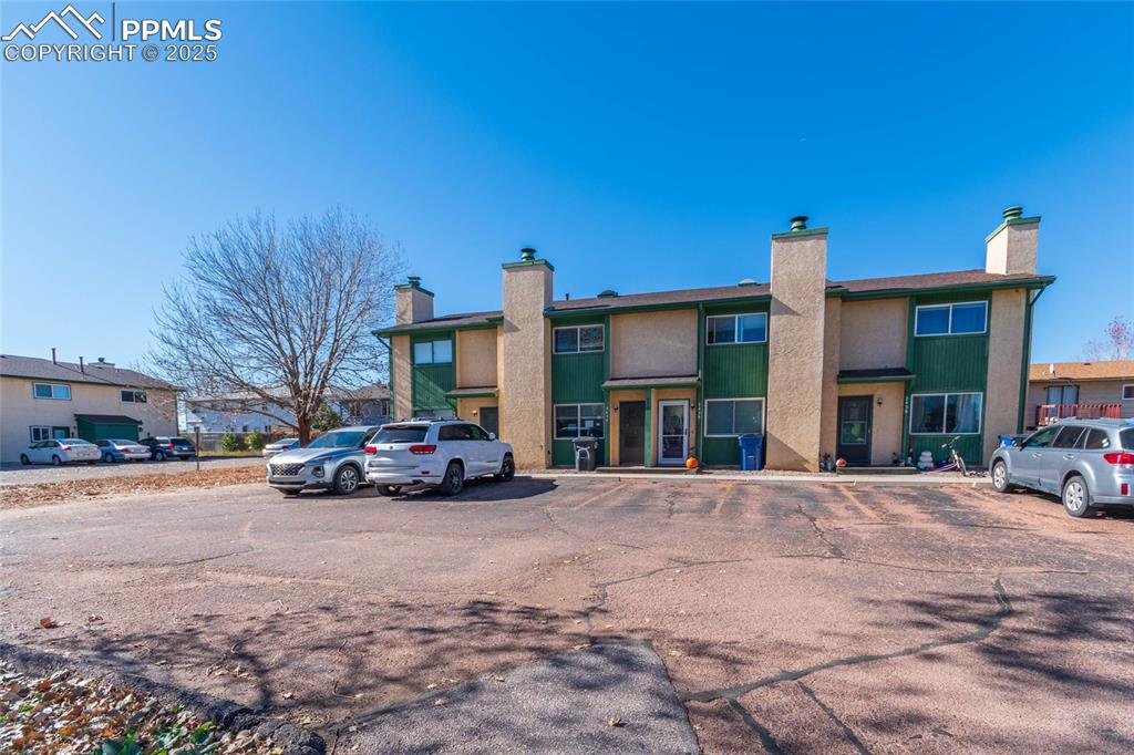 Image 2 of 35: View of property with uncovered parking