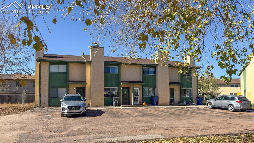 Image 4 of 35: View of property with uncovered parking