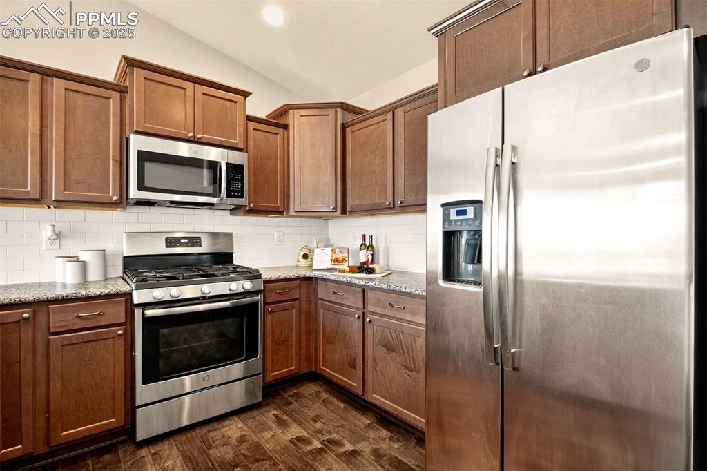 Image 12 of 37: Stainless steel appliances that includes a gas burning range