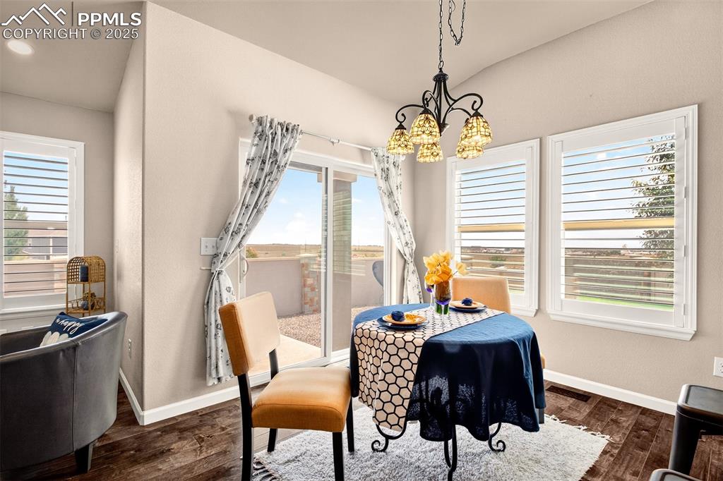 Image 15 of 37: Off the kitchen is the dining space with walkout access to the private back