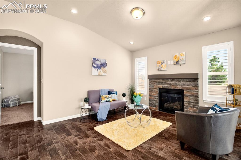 Image 17 of 37: Living room features a gas log fireplace 