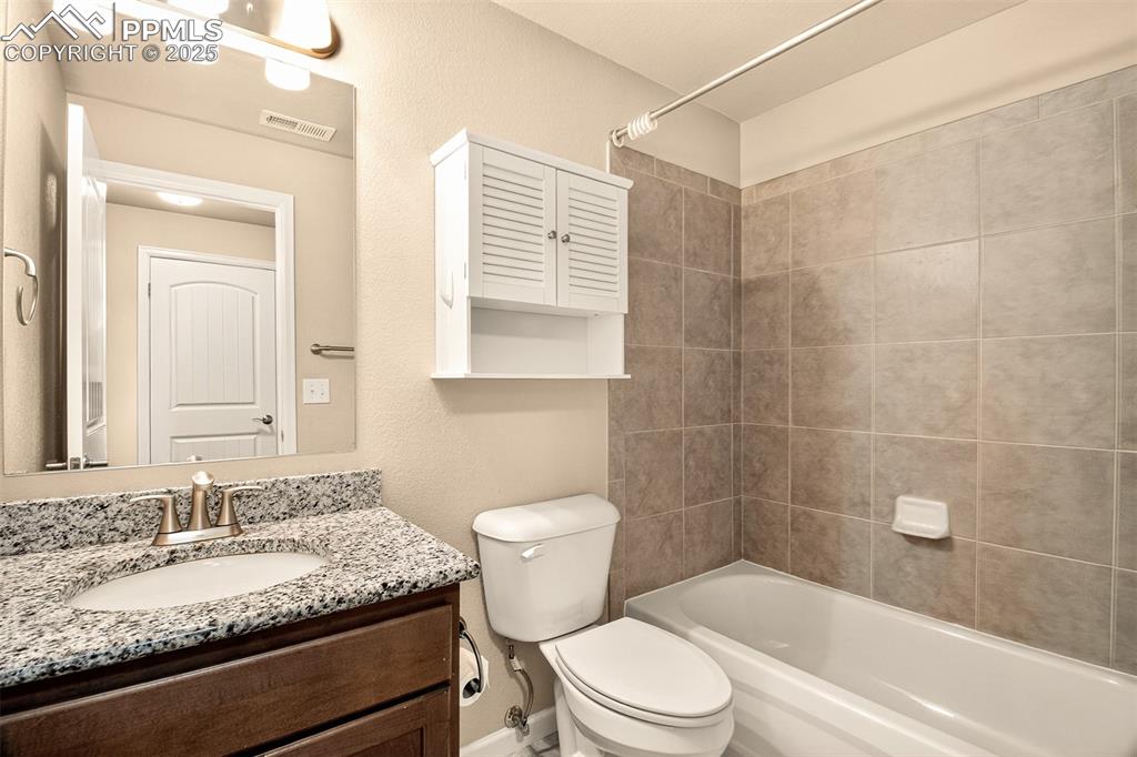 Image 28 of 37: Basement level full bathroom