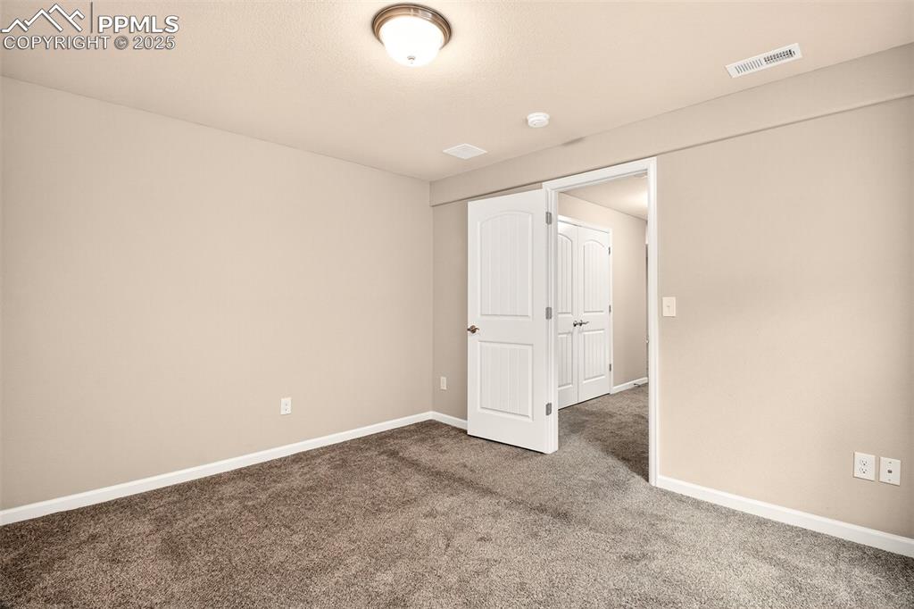 Image 29 of 37: Second basement level bedroom