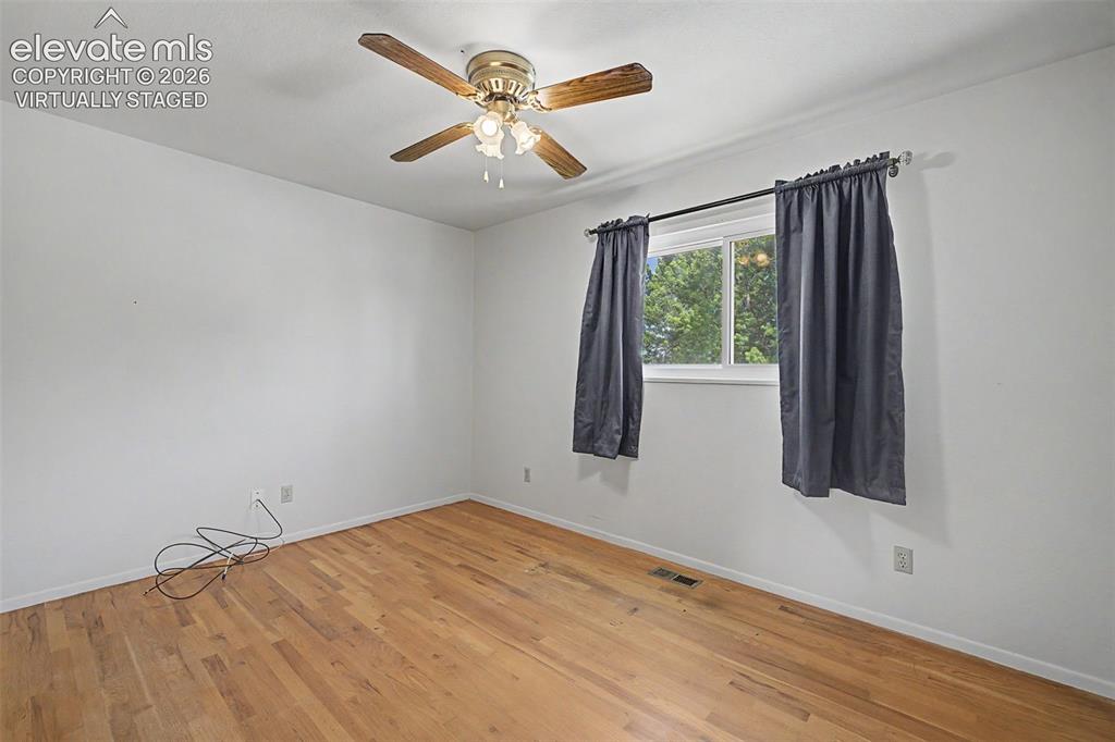 Image 25 of 50: Virtually Staged with flooring - wood flooring under carpet