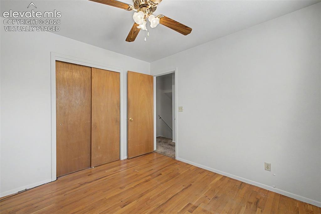 Image 33 of 50: Virtually Staged with flooring - wood flooring under carpet