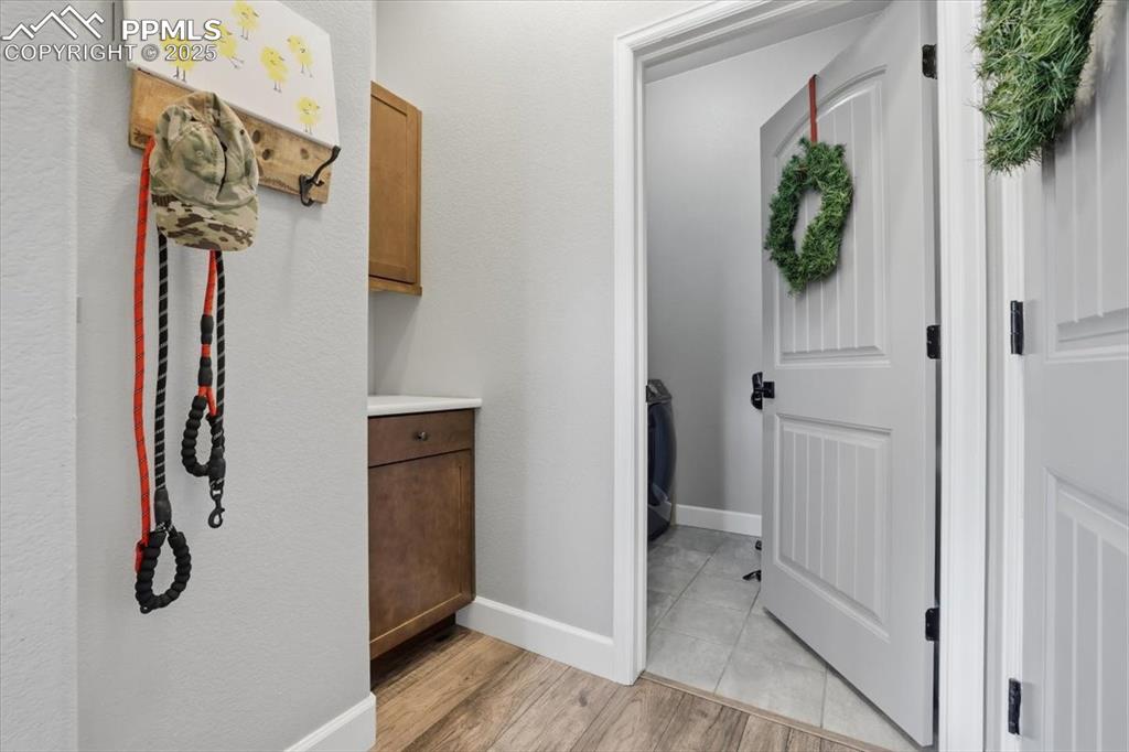 Image 13 of 31: Entrance from the garage and door to the Laundry on the main level.