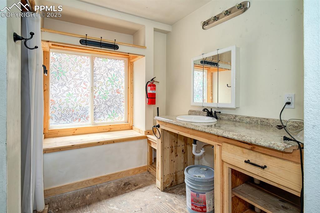 Image 14 of 17: Second 3/4 bath with extended vanity