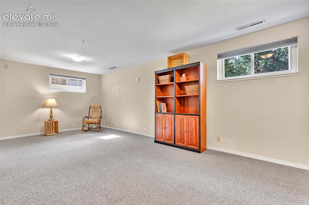 Image 12 of 26: Bonus/Flex room in basement with access to utility room and large storage r