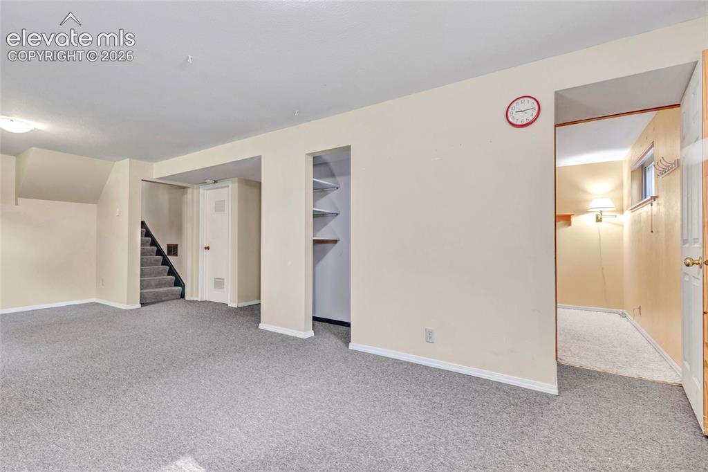 Image 13 of 26: Bonus/Flex room in basement with access to utility room and large storage r