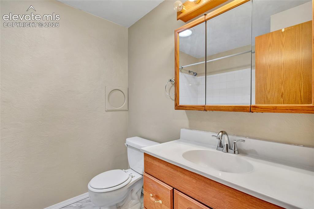 Image 20 of 26: Full bath with laundry chute