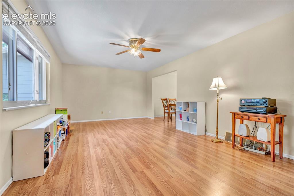 Image 6 of 26: Living room and entry