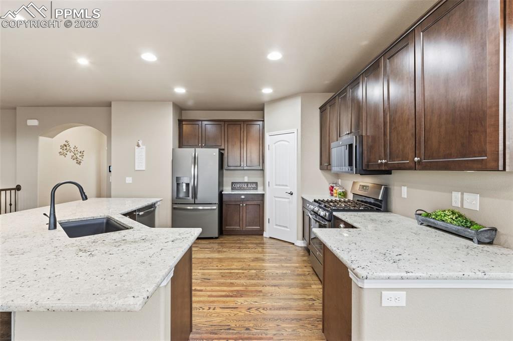Image 2 of 43: Granite Countertops and 42" cabinets with crown moulding.
