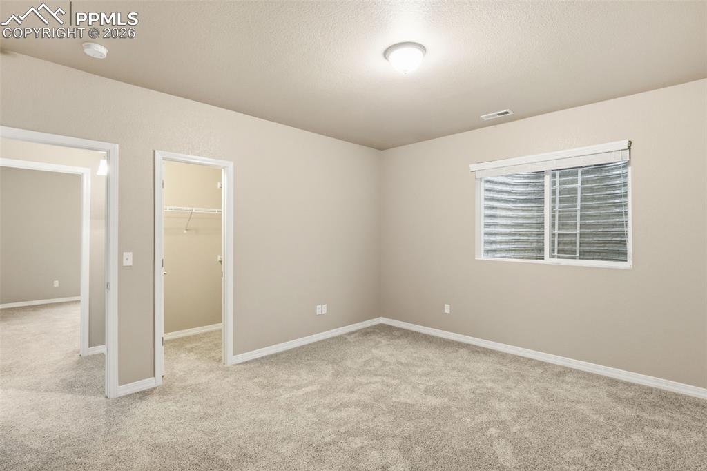 Image 33 of 43: Walk-in closet