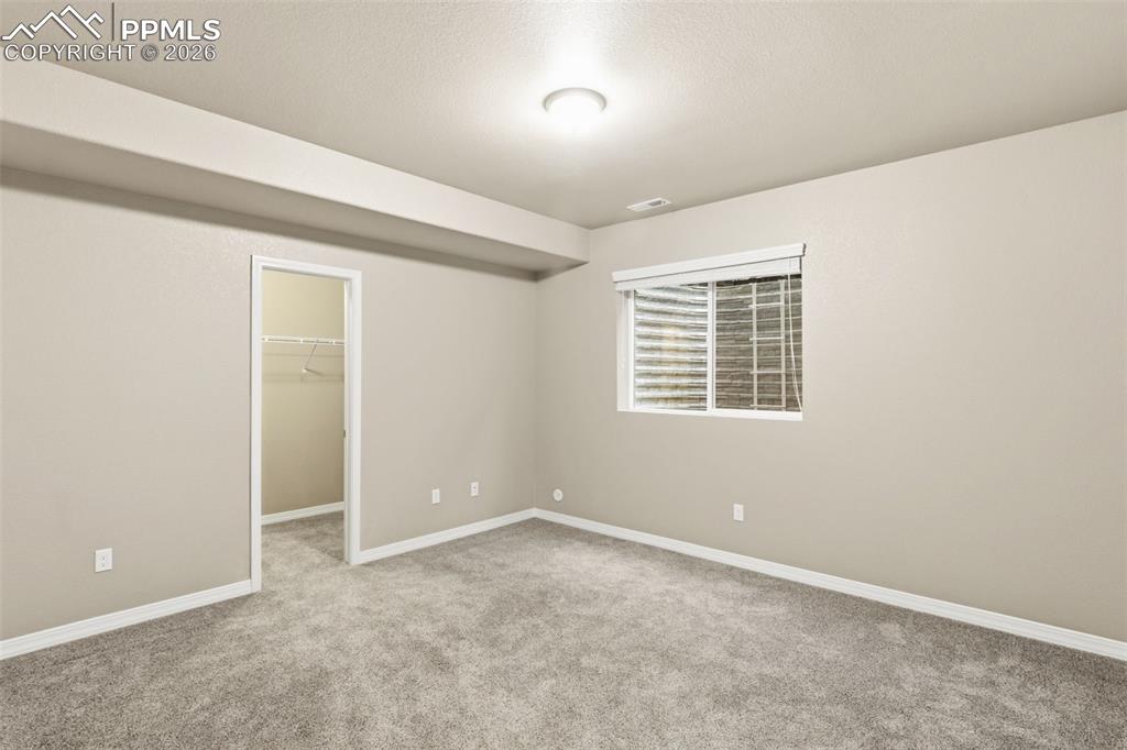 Image 39 of 43: Walk-in closet