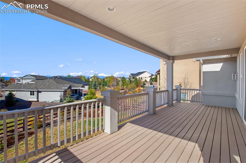 Image 4 of 43: Full sized covered deck with Pikes Peak Views