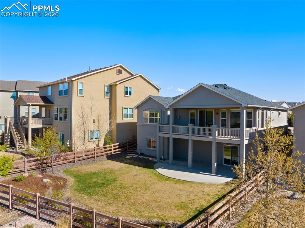 Image 5 of 43: Huge Covered Deck and Concrete Patio for Outdoor Living!