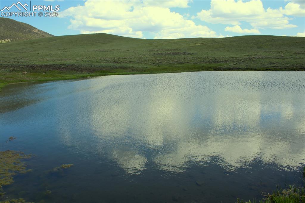 Image 12 of 18: Water view with a mountain backdrop