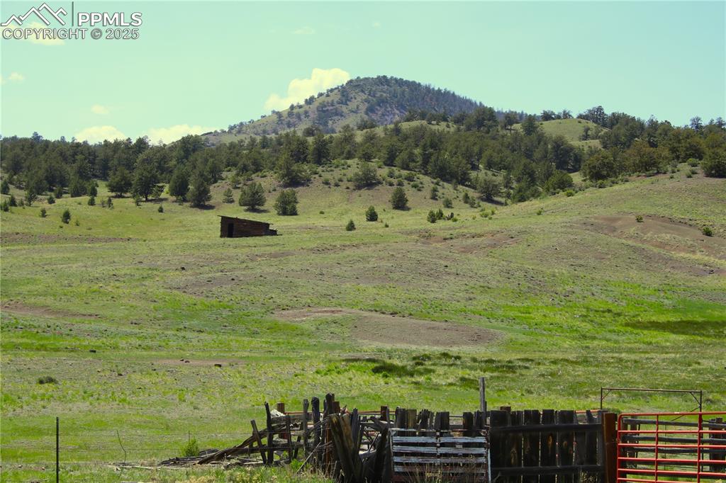 Image 16 of 18: View of mountain backdrop with rural landscape