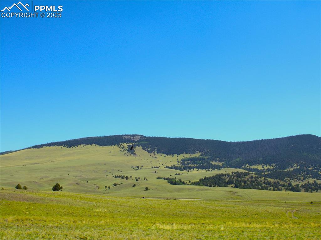 Image 6 of 18: View of mountain backdrop featuring rural landscape