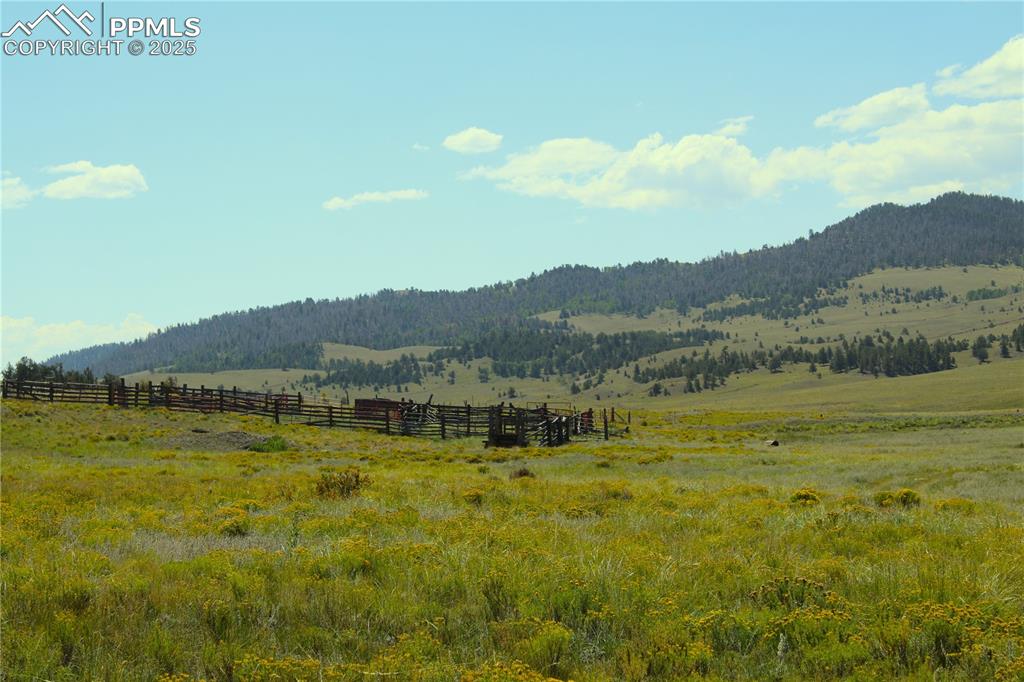 Image 7 of 18: Mountain view with rural landscape and agricultural land