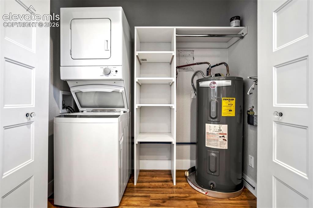 Image 41 of 50: Garage apartmentDedicated utility closet featuring a stackable washer and d