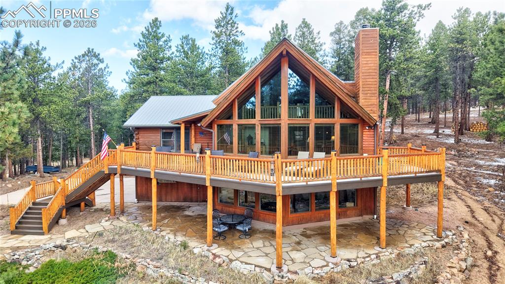 Image 1 of 43: Spectacular mountain cabin home with a 64-foot-long, new wrap-around deck,