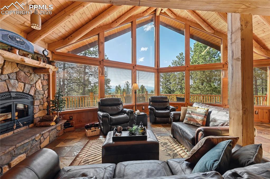 Image 11 of 43: The Southeast facing living room enjoys sunrise views of Pikes Peak from th