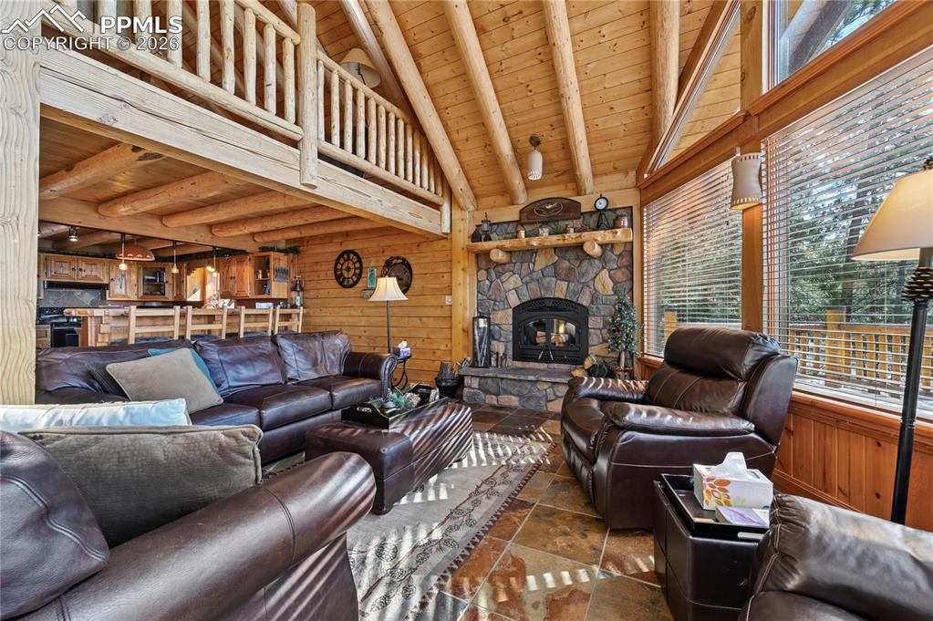 Image 13 of 43: The log construction creates drama but invites the peace of natural finishe