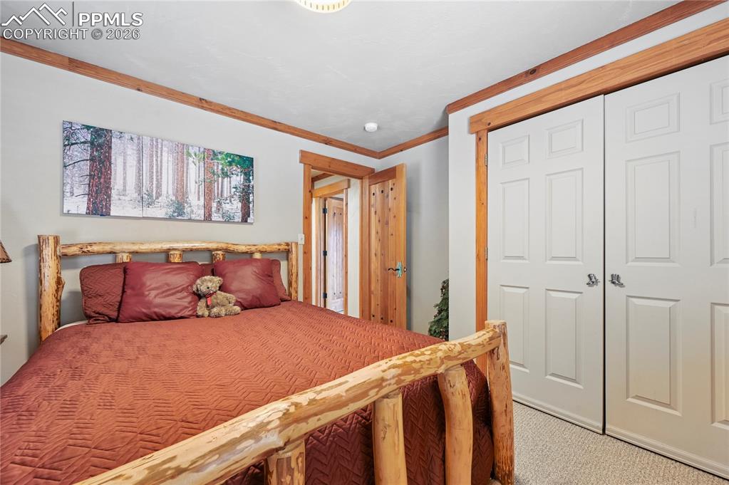 Image 19 of 43: Bedroom #2 of 5 is just around the corner from a full bathroom and enjoys t