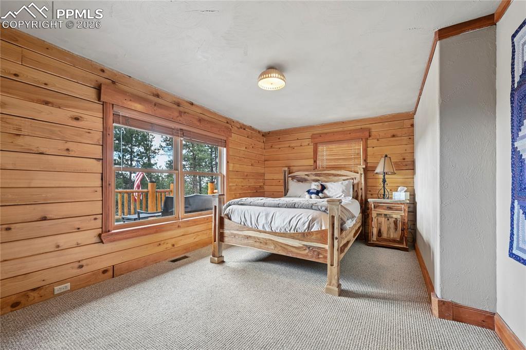 Image 20 of 43: Bedroom #3 of 5 is a larger secondary bedroom that could likely fit a king-