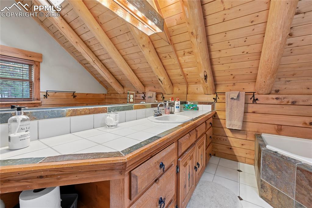 Image 26 of 43: The master bathroom gives you a nice place to relax with a two-person corne