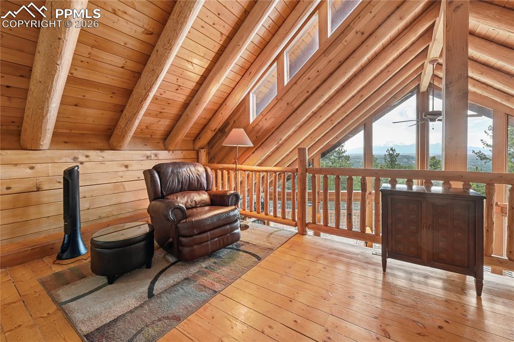 Image 27 of 43: The other half of the lofted master suite provides a sitting area with natu